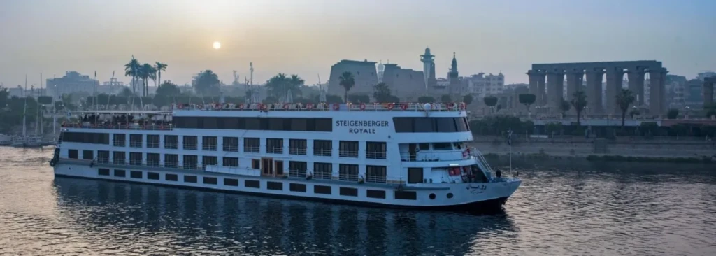 Steigenberger Royale Nile cruise ship passing Luxor Temple