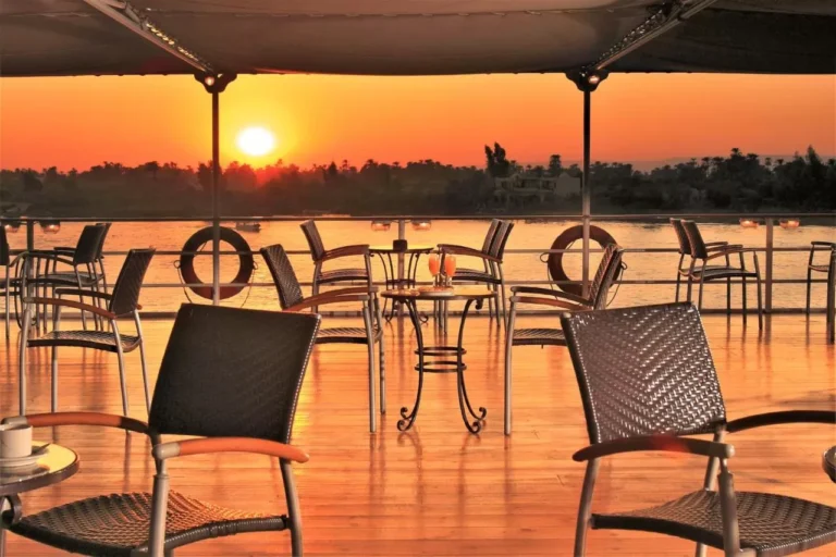 Deck chairs and tables at sunset on the Steigenberger Royale