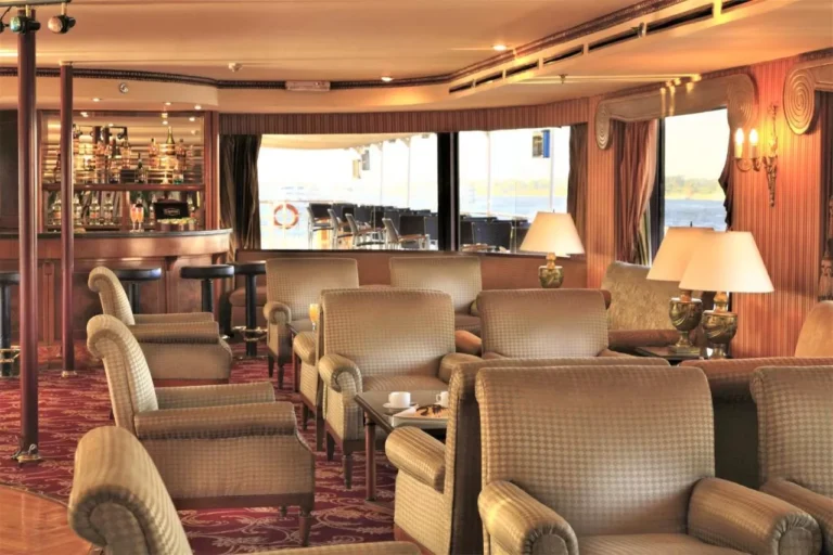 Lounge armchairs and table lamps by the bar on the Steigenberger Royale
