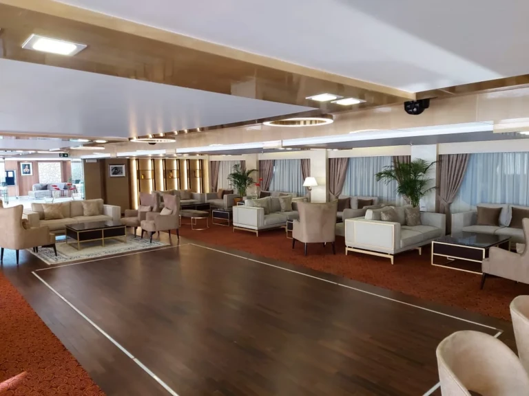 Sun Goddess lounge with wooden dance floor and armchairs