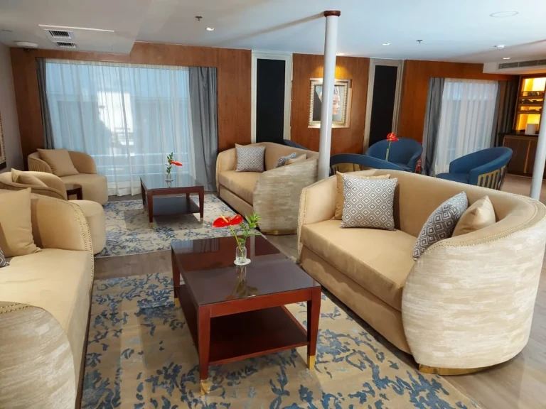 Beige sofas and wooden coffee tables in a Sun Goddess lounge