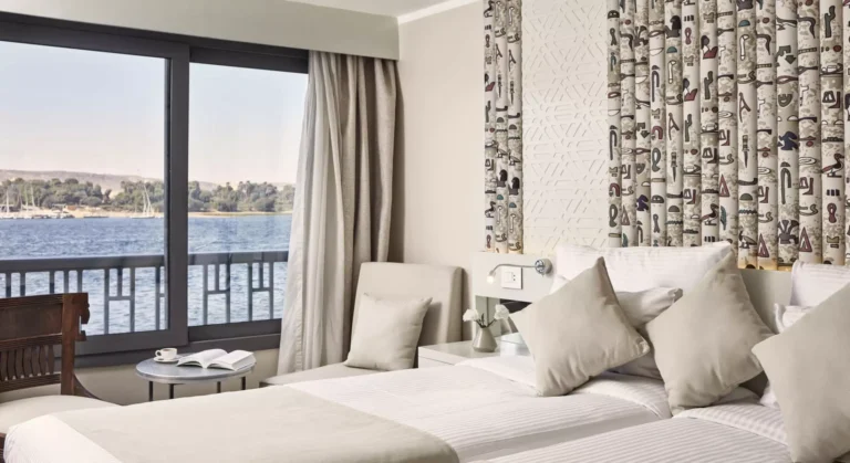 Tulip twin cabin with hieroglyph-patterned wall and river view