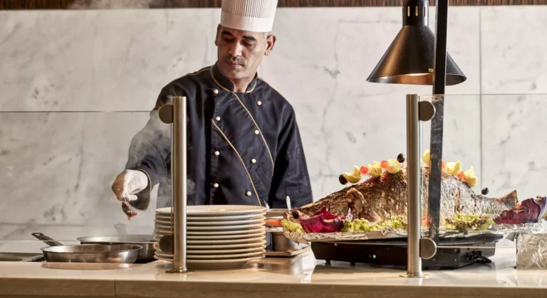 Chef cooking at the live station on the Tulip