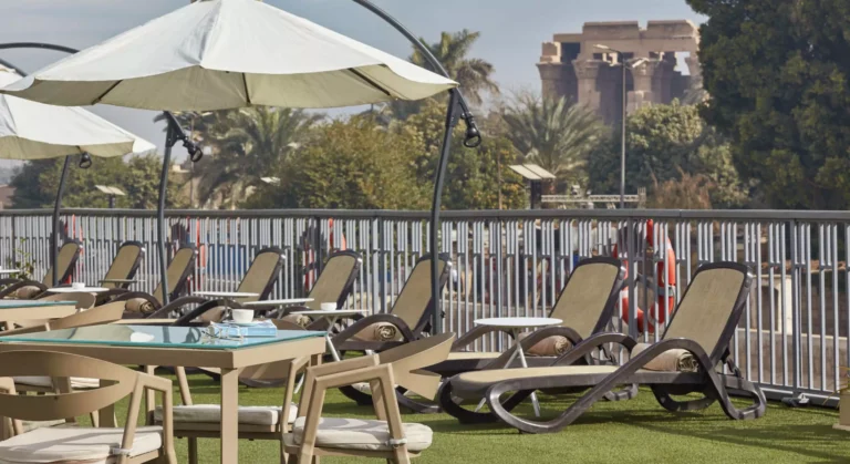 Palm-lined garden with loungers and umbrellas, Tulip Nile Cruise