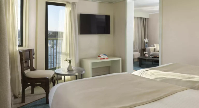 Tulip cabin bed facing a wall-mounted TV and sitting area