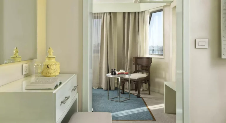 Tulip suite sitting nook with chair, side table and window