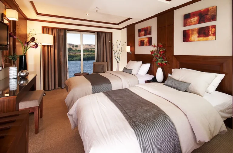 Twin cabin with balcony door and Nile view on the Farah