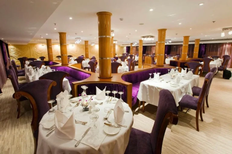Al Hambra restaurant with set tables and wooden columns