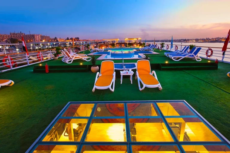 Al Hambra sun deck with loungers and pool at dusk