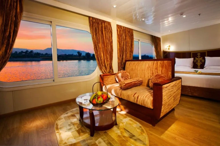 Suite sofa beside a window at sunset on the Al Hambra