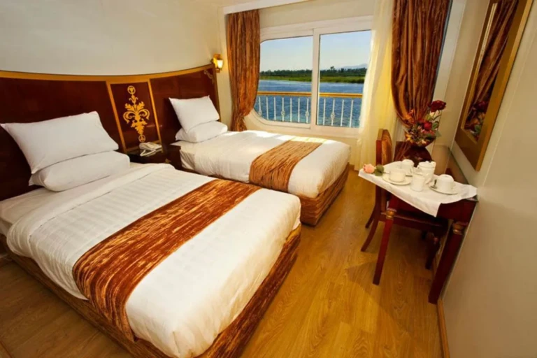 Twin cabin with breakfast table by the window on the Al Hambra