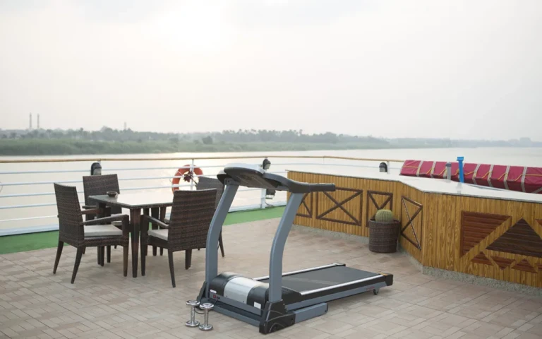 Treadmill and dining set on the Blue Shadow open deck