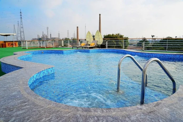 Blue Shadow sun deck swimming pool with steel ladder