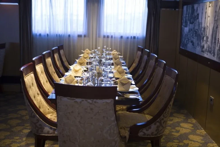 Long set dining table in a private room on the Blue Shadow