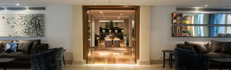 Farida lobby corridor with sofas and wall artwork
