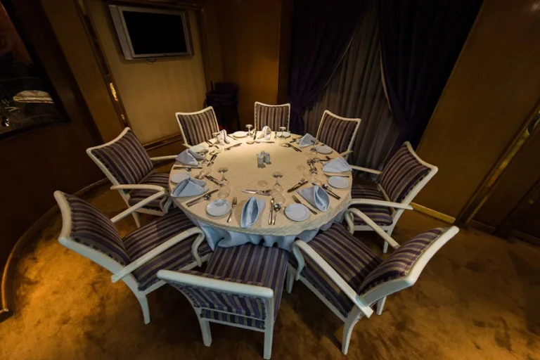 Round dining table set for ten in a private dining room