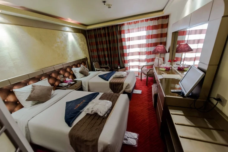 Twin bed cabin with striped curtains on Royal La Terrasse