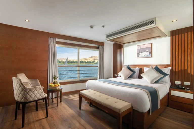 Nile Capital cabin with double bed, armchair and Nile window