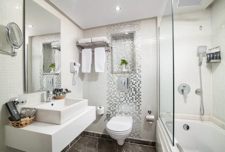 Nile Capital bathroom with mosaic tiles and bathtub