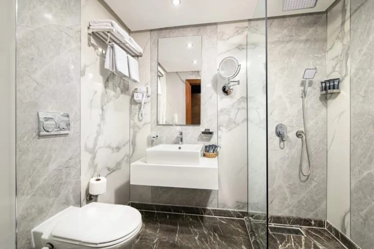 Marble bathroom with walk-in glass shower on the Nile Capital