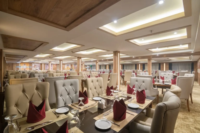 Nile Capital restaurant with grey upholstered chairs and red napkins