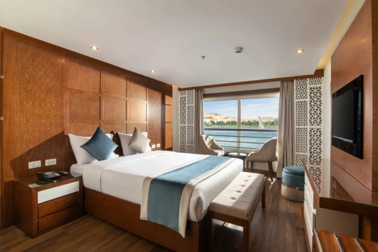 Nile Capital cabin with wood-panelled walls and river view balcony