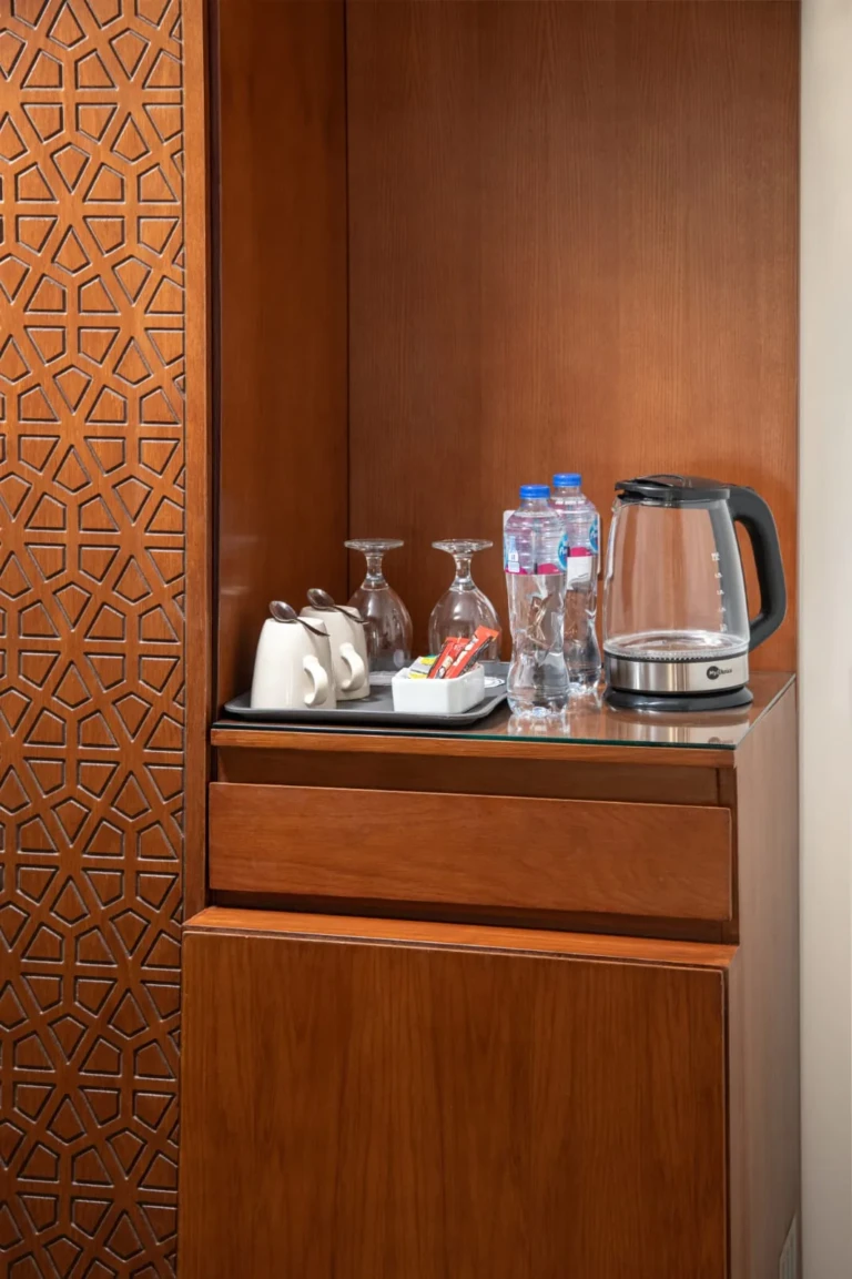 Tea and coffee station with kettle and glasses in a Nile Capital cabin