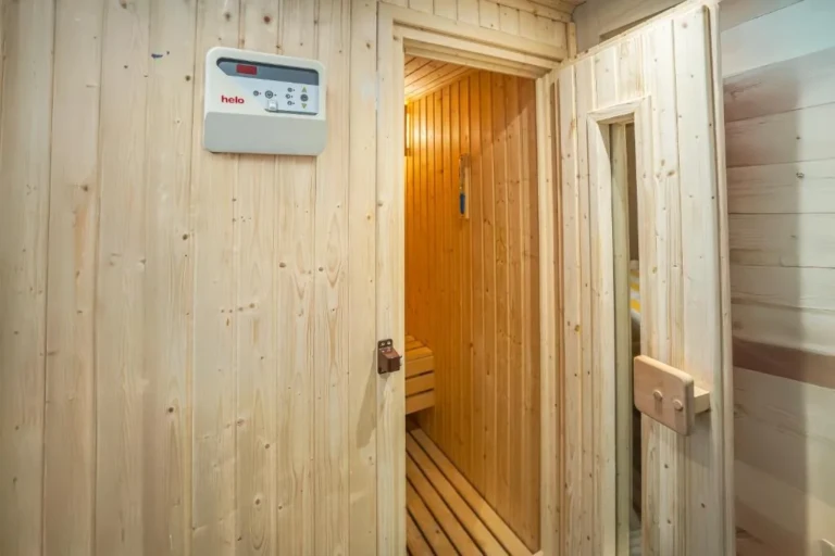 Wooden sauna cabin with control panel on the Renaissance