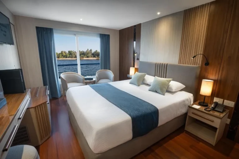 Renaissance double cabin with blue bed runner and river window