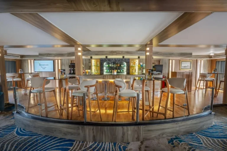 Bar with high stools around a wooden counter on the Renaissance