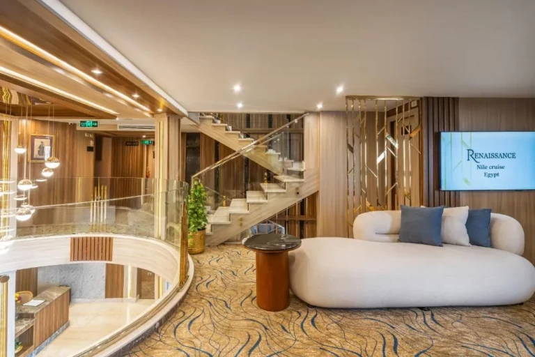 Lobby with curved white sofa and staircase on the Renaissance