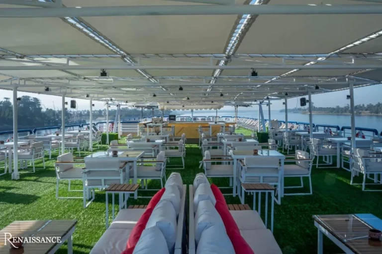Shaded sun deck with white chairs and tables on the Renaissance