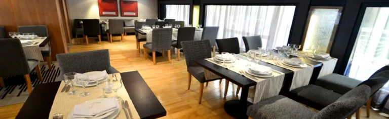 Salima restaurant tables set by large windows