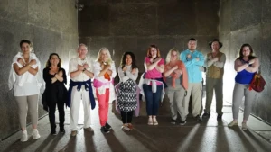 Tour group posing inside a burial chamber of the Great Pyramid