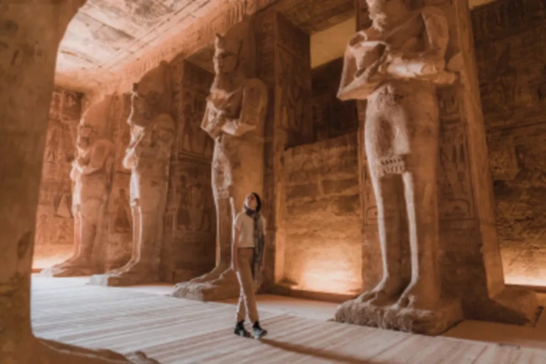 Traveller among Osiride statues inside Abu Simbel Great Temple