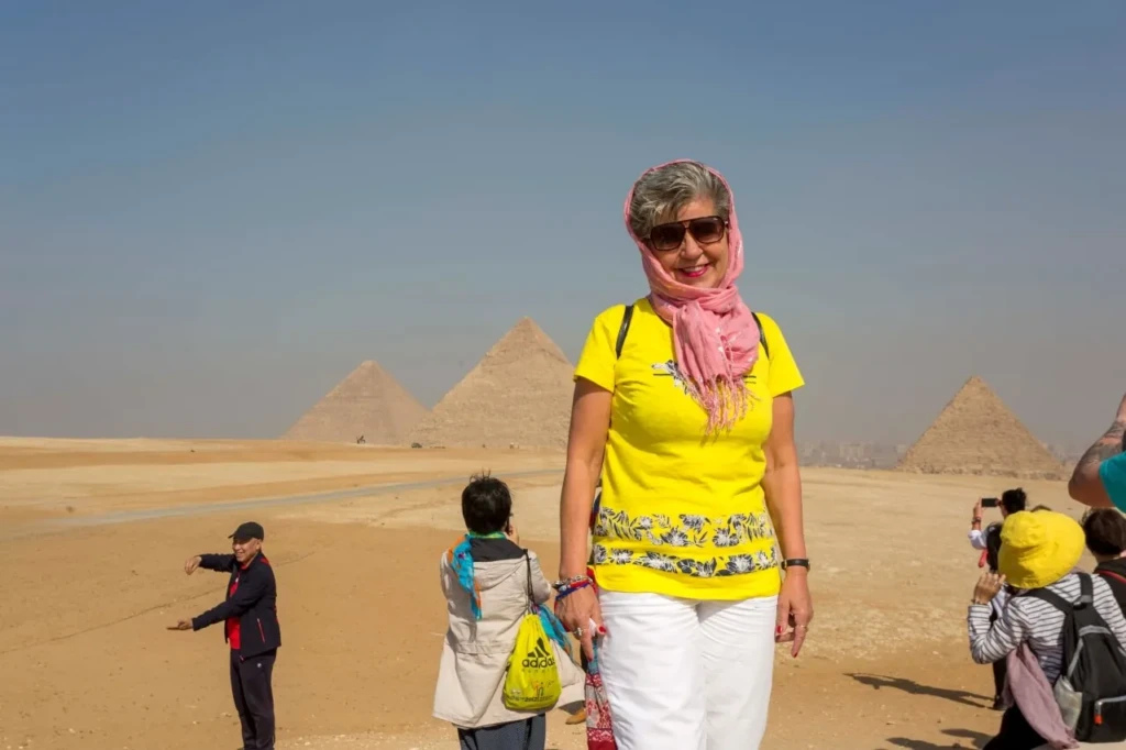 Traveler in a headscarf at the Giza pyramids viewpoint