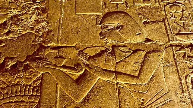 Close-up of a carved relief with hieroglyphs at Luxor Temple