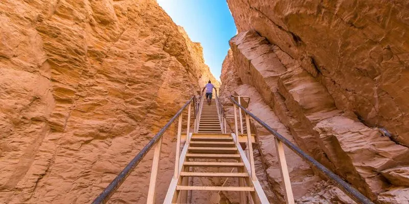Wooden stairway up a rock gorge to a tomb in the Valley of the Kings