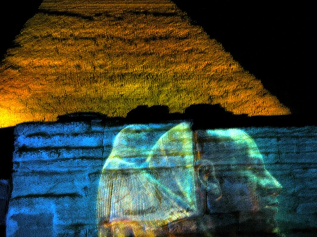 Pyramid and Sphinx lit up at night at Giza
